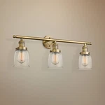 Small Bell 30" Wide Clear Glass - Brushed Brass Bath Light. Fixed Price $539.00.